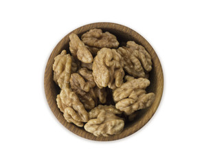 Kernels walnuts isolated on white. Walnuts in a bowl isolated on white background. Top view. Walnuts with copy space for text on a white background