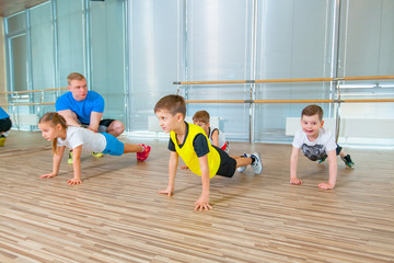 Children at physical education lesson in school gym gymnast kid
