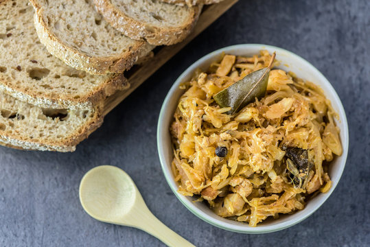 Bigos - traditional Polish Easter and Christmas dish - closeup in green bowl.