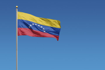 Venezuela Flag of in front of a clear blue sky
