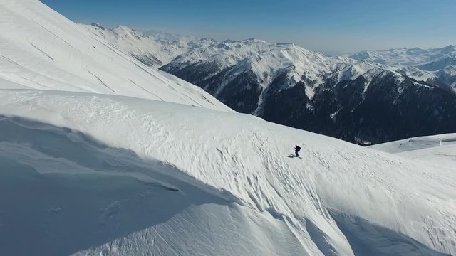 Woman Skitouring In Snowy Moutains aerial