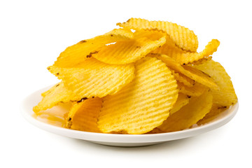 Bunch of potato chips in white plate, close up.