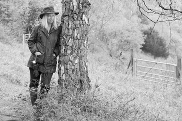 Women against tree enjoying quiet and solitude