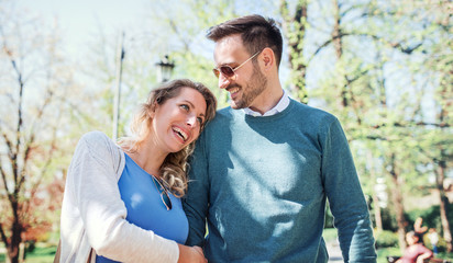 Meeting in the park. Romantic couple having fun in the park. Love, dating, romance