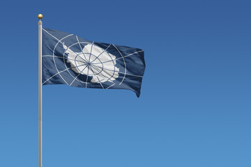 Antarctica Treaty flag and blue sky © Derek Brumby