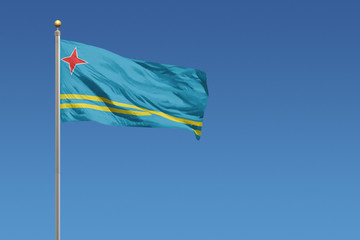 Aruba flag on a clear blue sky day