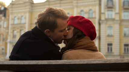 Attractive young people kissing for the first time, romantic atmosphere, autumn