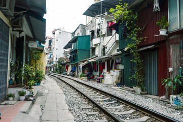 Fototapeta na wymiar A railroad close to the houses in Hanoi, Vietnam