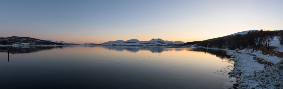 Mirror-like reflections in a Norwegian fjord near Tromsø, Norway