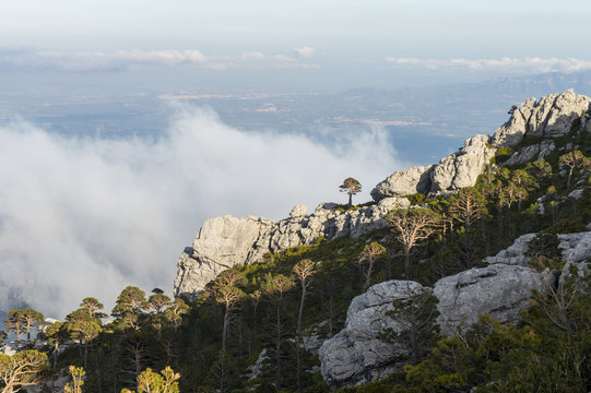 Rocky andscape at Puertos de Beceite (Ports de Beceit) with clouds over the mountains