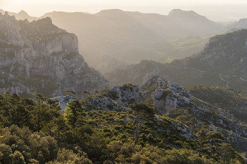 Fototapeta na wymiar Beautiful sunrise landscape at Puertos de Beceite National Park showing Mediterranean vegetation and rocky mountains with contralight