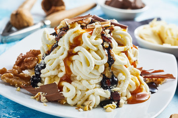 Spaghetti ice cream with fudge caramel topping