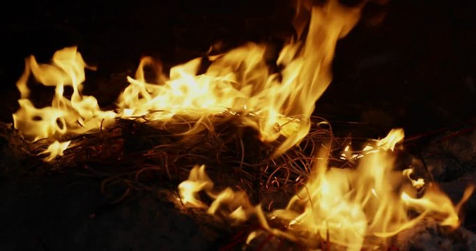 Closeup of flame on the Chinese fireplace to burn incense sticks and paper money on Chinese New Year in Chinese temple at Glodok, Jakarta. Shot in 4k resolution
