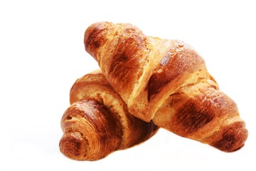 Homemade French Croissants isolated on white, selective focus