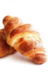 Homemade French Croissants isolated on white, selective focus