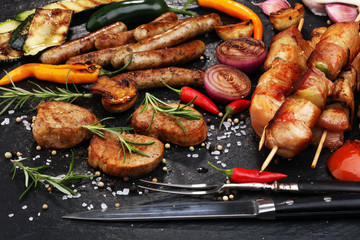 Assorted delicious grilled meat with vegetable on a barbecue