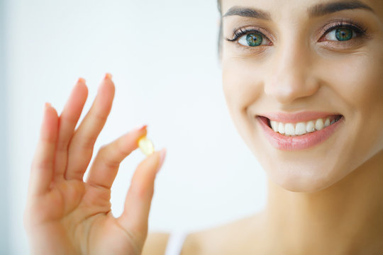 Beautiful Woman Taking Pill, Medicine. Vitamins And Supplements
