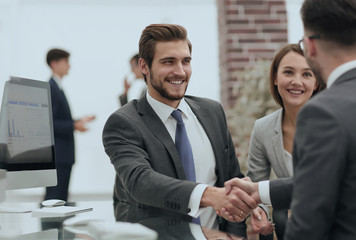 happy man introducing businesswoman to business partners