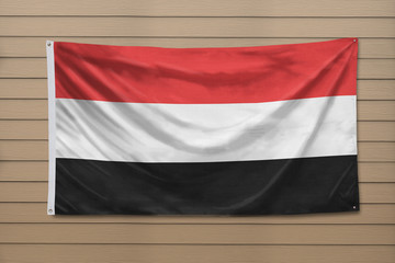 Flag of Yemen hanging on a wall