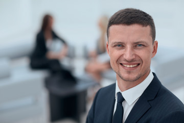 successful businessman on blurred background office