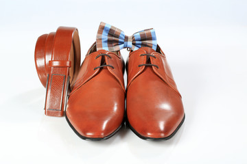 male elegant brown shoes with belt and bow tie