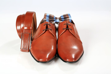 male elegant brown shoes with belt and bow tie