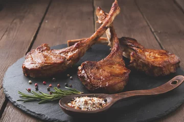 Foto op geborsteld aluminium Grill / Barbecue roasted lamb ribs loin chop on a stone surface