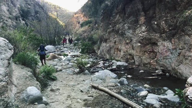 People hiking through rocks on mountain
