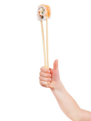 Child holding sushi roll on white background