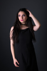 Fototapeta premium Young arabic woman isolated on gray background