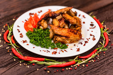 Chicken wings grilled with spices and chili pepper