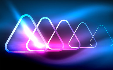 Glowing vector triangle geometric shapes in dark space