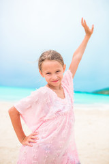 Fototapeta na wymiar Portrait of beautiful girl on the beach dancing