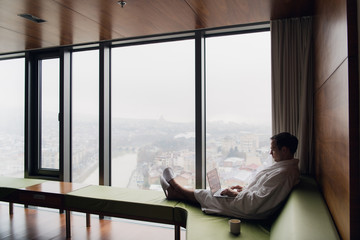 Young man freelancer working from home on a laptop