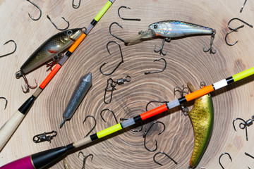 Fishing accessories,Sudak, Russia, April 26, 2018: Spoon-baiters for fishing on a wooden background