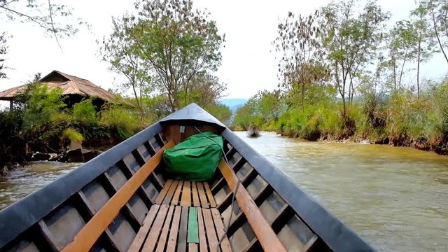 INLE LAKE, MYANMAR - FEBRUARY 18, 2018: Canoe trip along the banks of Inn Thein (Indein) village, famous tourist landmark next to Inle Lake, on February 18 in Inle lake.