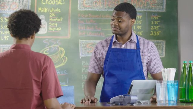 Customer ordering coffee in a coffee shop