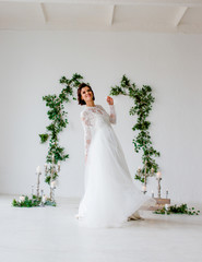 Fototapeta premium A wonderful bride is whirling in a wedding dress.
