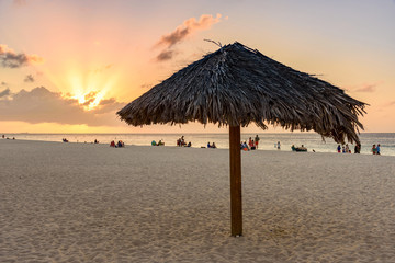 Parasol at sunset on a tropical beach