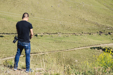 Man urinating in the bushes