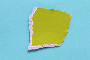 colored torn paper as a background. copy space