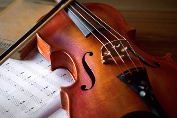 Fototapeta premium Beautiful Antique Violin and Book