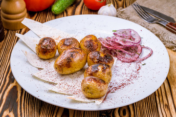 Potatoes roasted on the coals