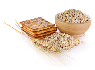 Barley ear and biscuits isolated on white background