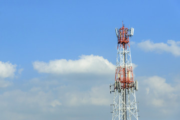 The telecommunication tower with the blue sky.