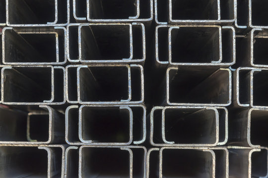 The rectangle C shape of profile pipes.The closeup of the steel bar structure for construction in the shelf.