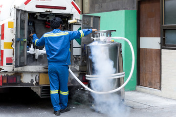 Technician with car nitrogen and fill liquid nitrogen