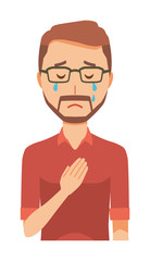 A bearded man wearing eyeglasses is crying