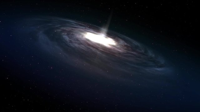A spiral galaxy rotates in deep space. Looping.  	