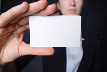 Businessman shows business card with the inscription: